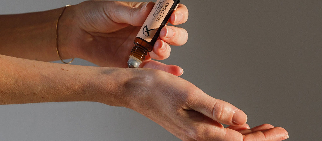 Applying the Sweet Bee Calming Roller to the wrist